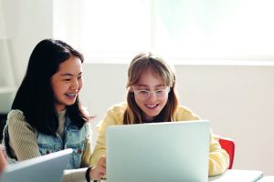 Two-young-female-girls-students-computer-300x200.jpg
